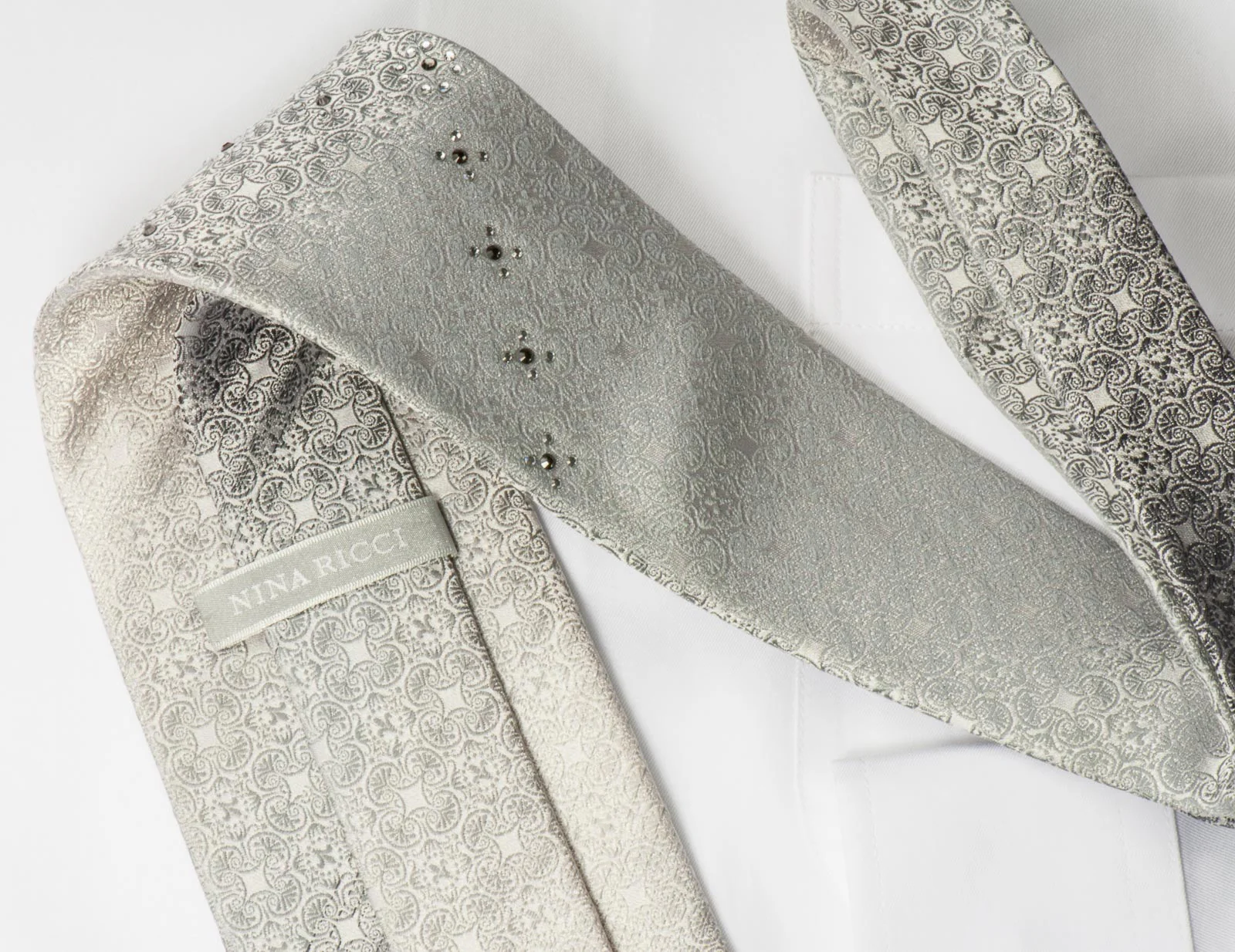 Nina Ricci Mens Rhinestone Silk Necktie Silver Fleur De Lis Motif Design On White - Image 4